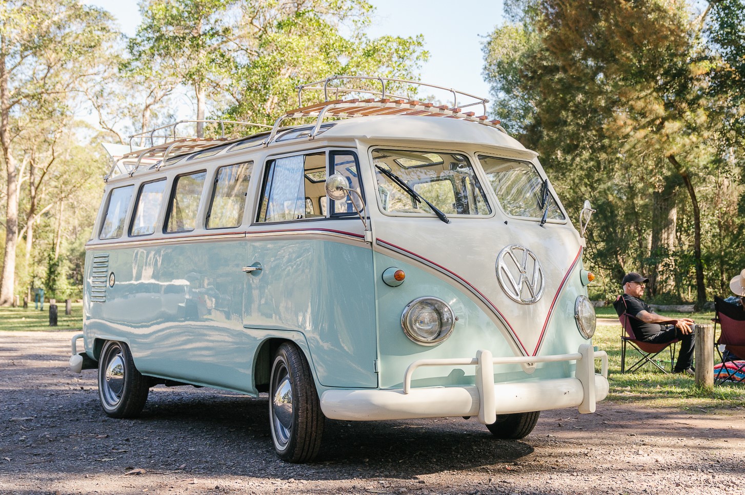 Teal / Light blue Kombi Van in the outdoors